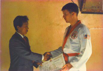 Kevin W. Putala receiving his first Dan from Master Yun Tak Bong
